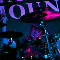 Tim Wilson plays the drums
